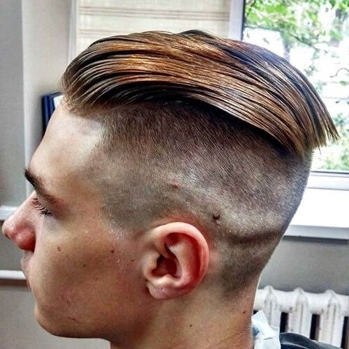 croped hair hard slicked back design bald skin fade