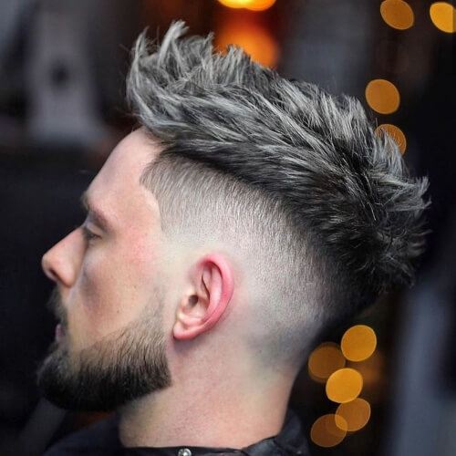 mexican haircut gray messy spikes on top side mid to low fade