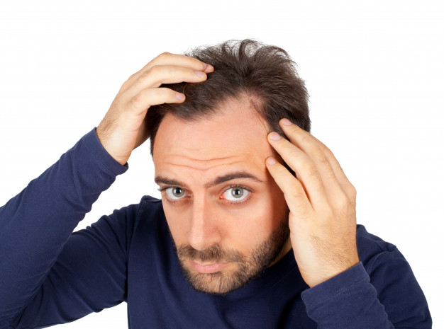 man-controls-hair-loss